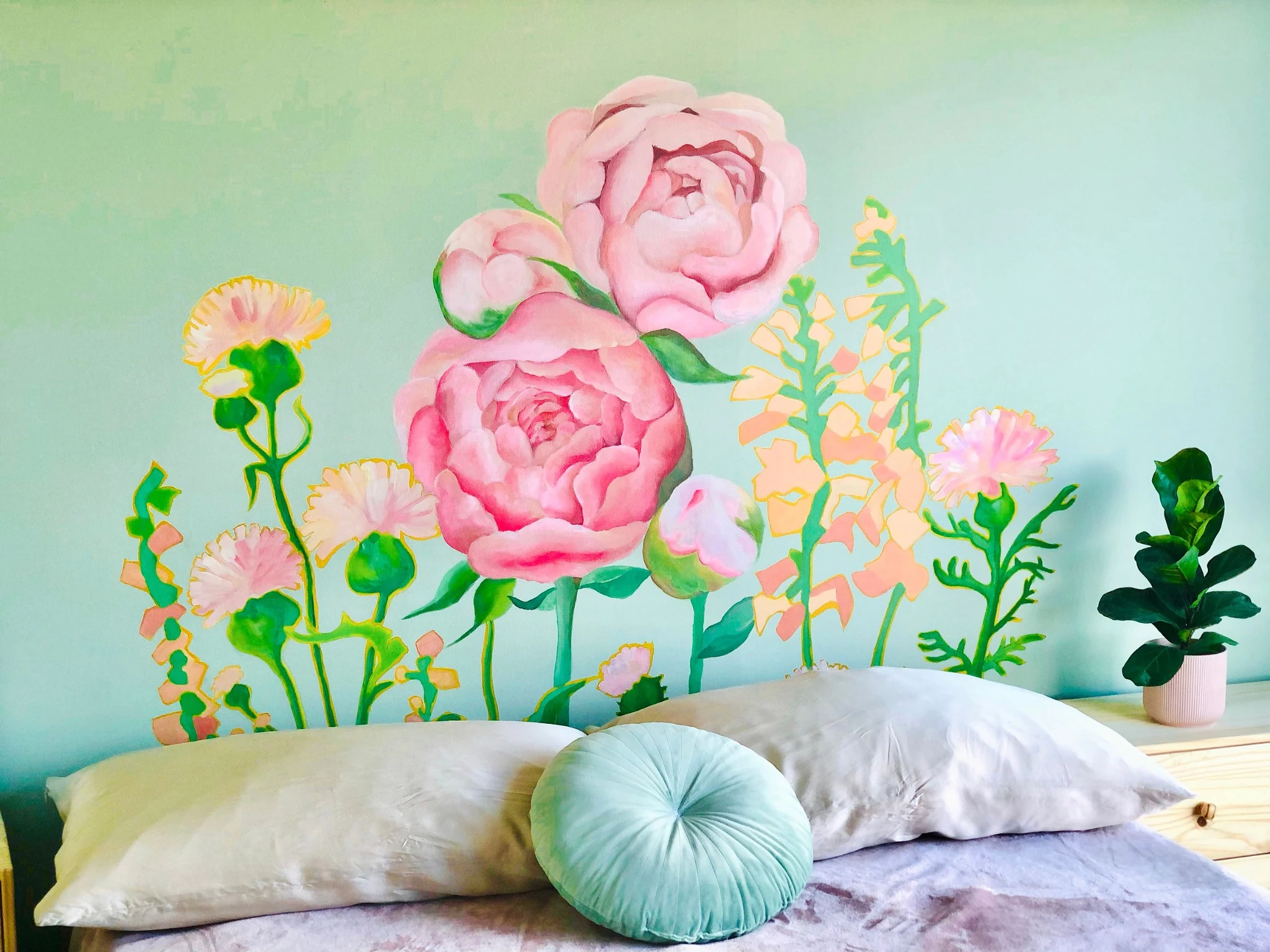 Hand-painted floral bedroom mural by Jade Yu Han, featuring oversized pink peonies and delicate flowers against a pale mint wall